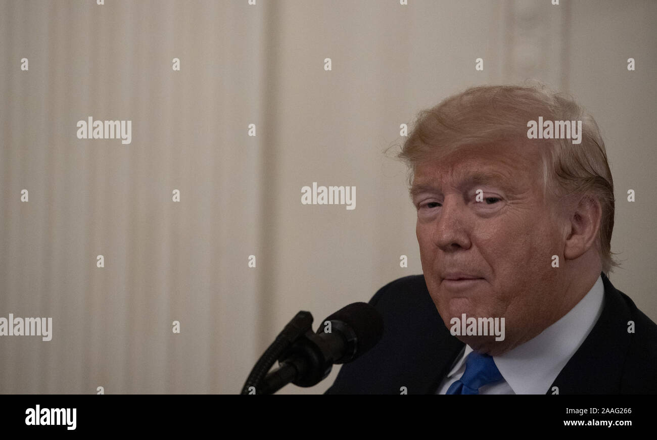 President Donald Trump presents the National Medal of Arts and the National  Humanities Medal to Staff Sergeant Jan Knutson, in honor to The Musicians  of the United States Military, during a ceremony