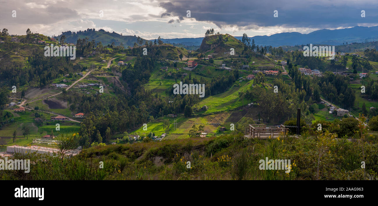 Late afternoon sunlight on green hills; panoramic view from Ictocruz in Cuenca, Ecuador. Stock Photo