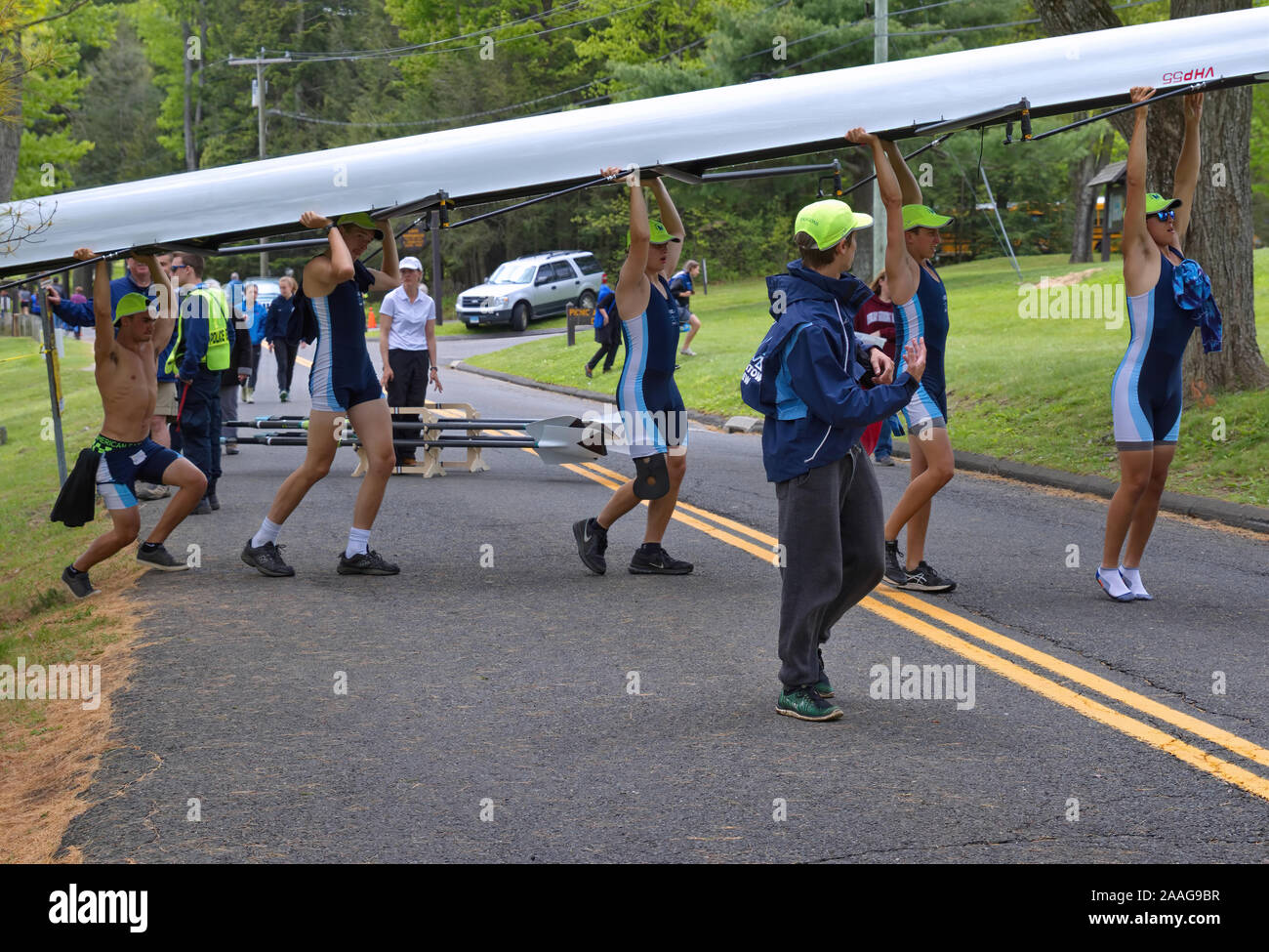 New Preston, CT USA. May 2016. Teamwork never ends as all Crew members lift boat to be racked after docking. Stock Photo