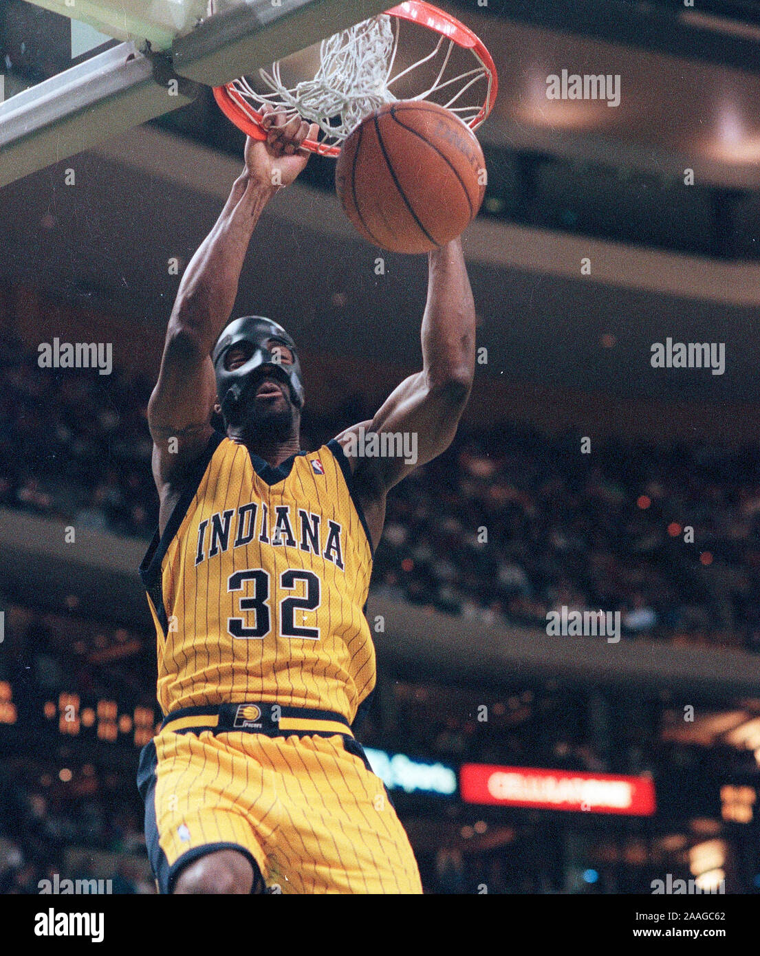 Indiana Pacers #32 Dale Davis slam dunks the ball in basketball game action against the Boston Celtics at the Fleet Center in Boston Ma USA Feb9,2000 photo by bill belknap Stock Photo