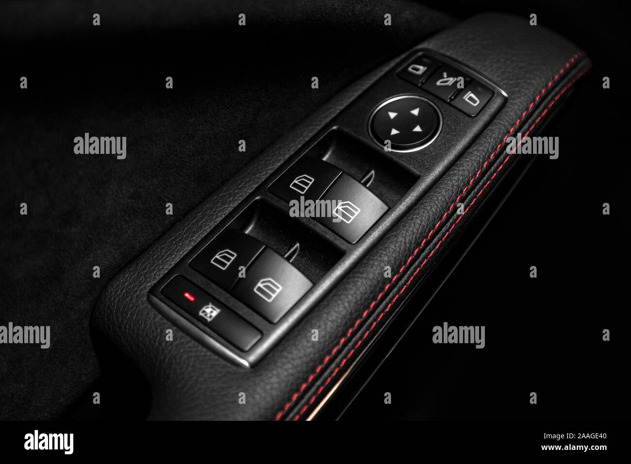 Close up of a door control panel in a new modern car. Arm rest with