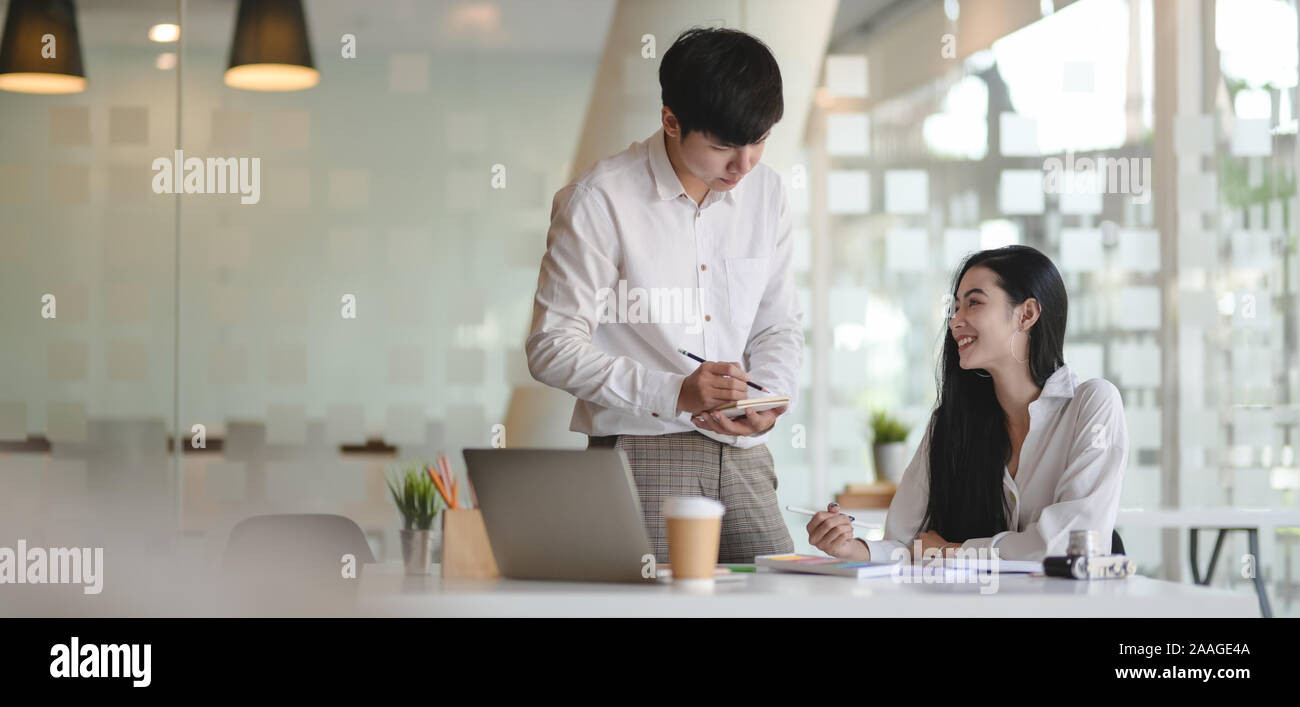 Portrait of two young professional designer planing the idea about ...