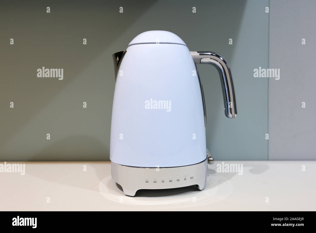 https://c8.alamy.com/comp/2AAGEJR/blue-electric-kettle-on-the-table-2AAGEJR.jpg