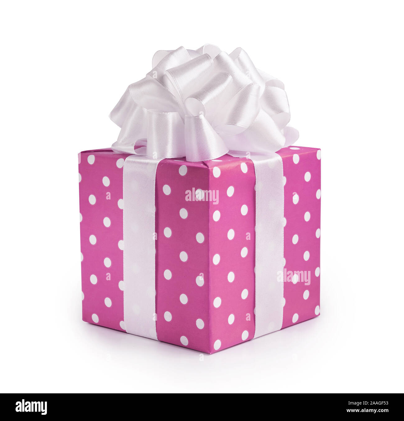 Beautiful decorative pink gift box with white bow. Happy Women's Day or Christmas and New Year's Day. Stock Photo