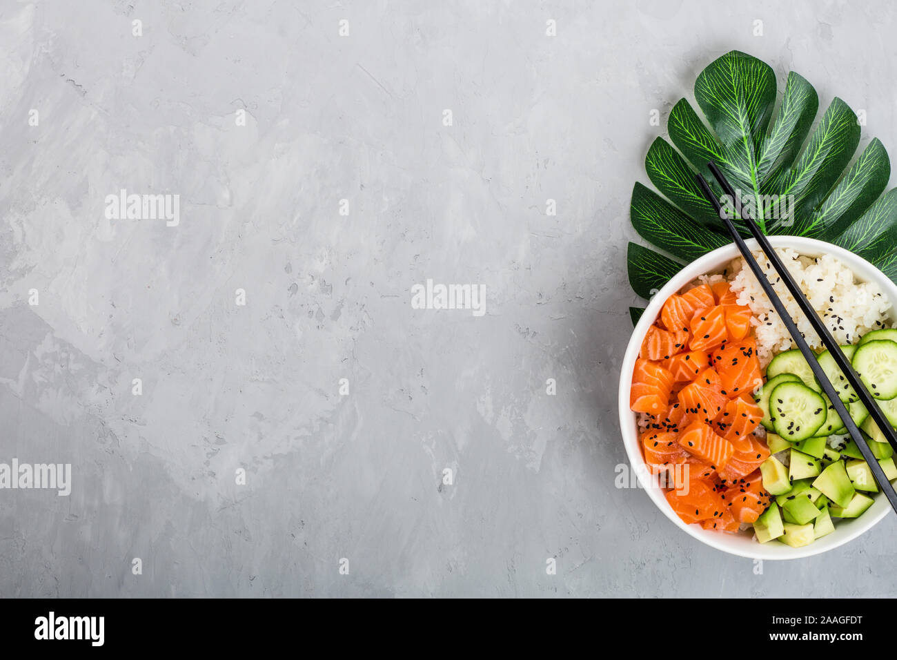 Download Hawaiian Salmon Bowl With Cucumbers Avocado Sesame Seeds And Rice Top View Overhead Flat Lay Mock Up Template Healthy Food Concept Stock Photo Alamy