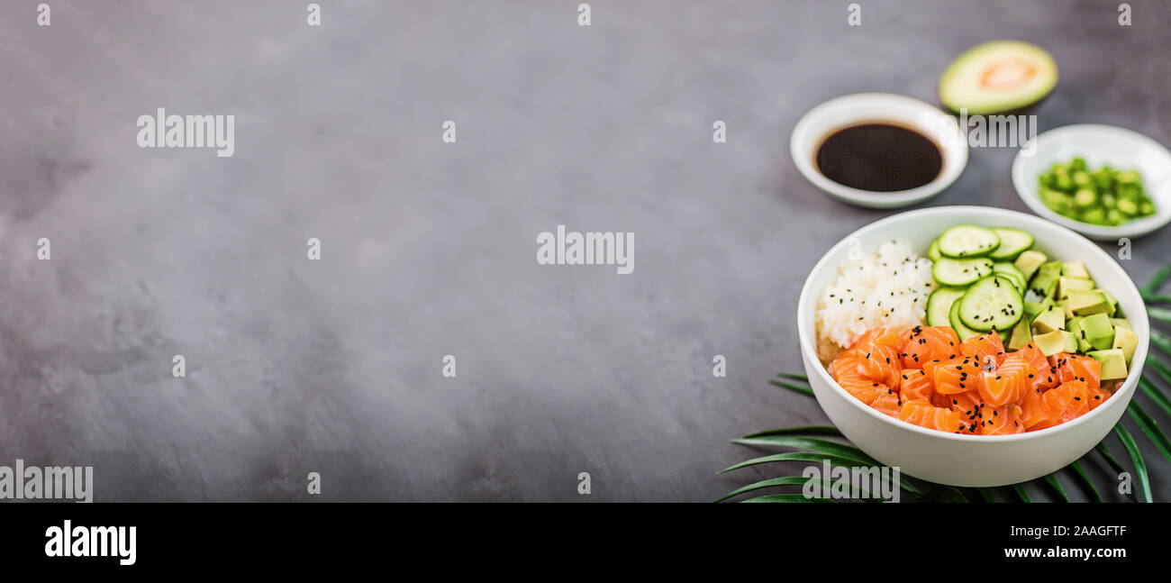 Hawaiian salmon bowl with cucumbers, avocado, sesame seeds and rice