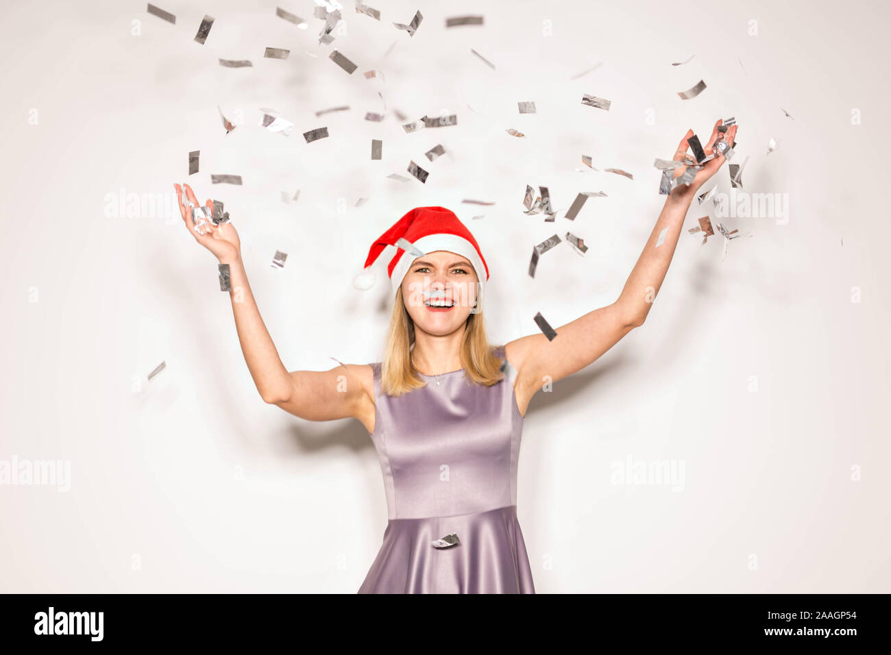 New year and holidays concept - Happy excited young woman in santa ...