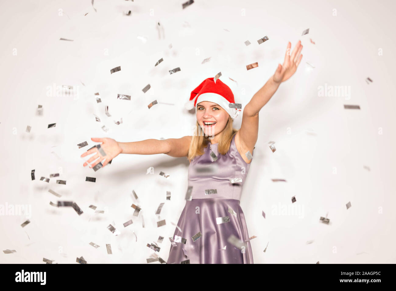 New year and holidays concept - Happy excited young woman in santa ...