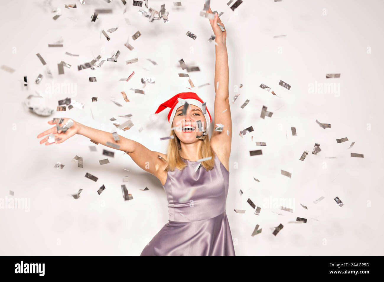New year and holidays concept - Happy excited young woman in santa ...