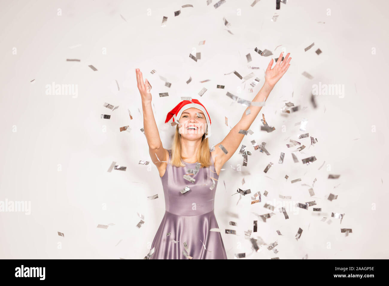 New year and holidays concept - Happy excited young woman in santa ...