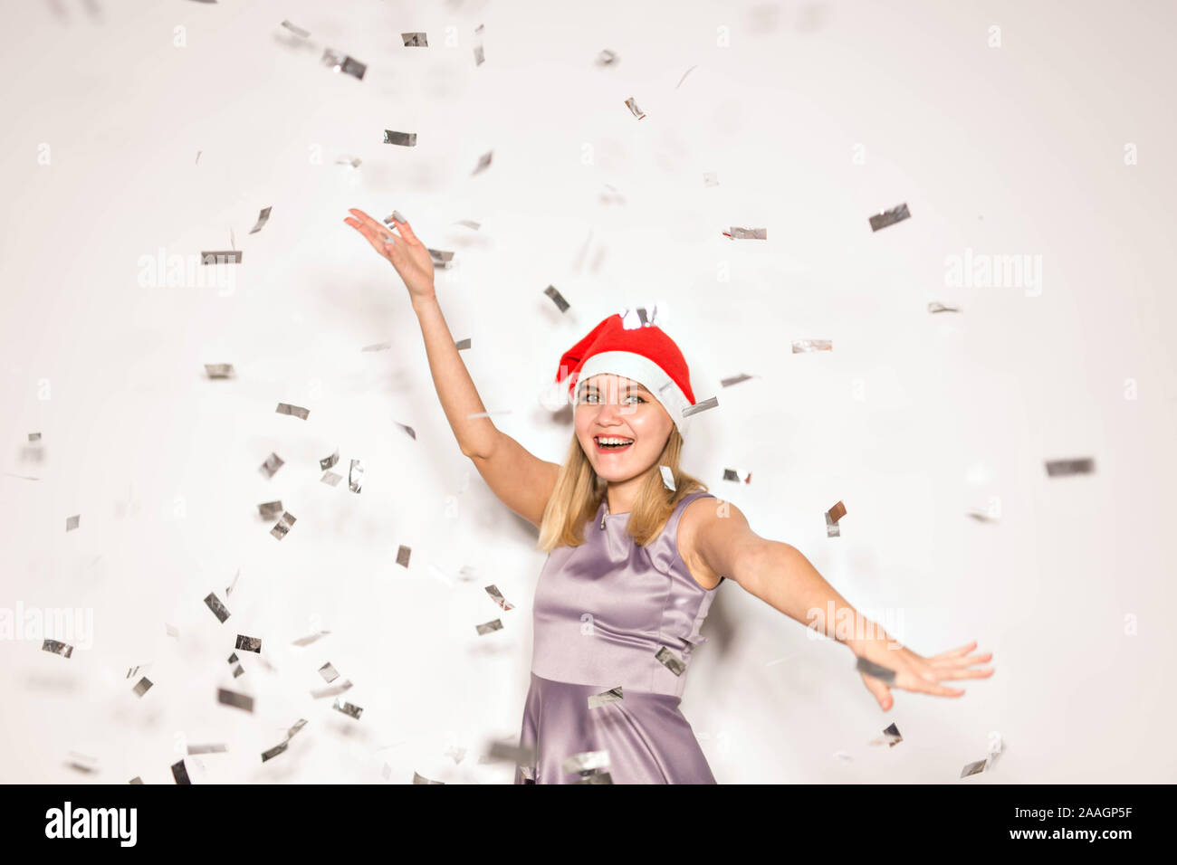 New year and holidays concept - Happy excited young woman in santa ...