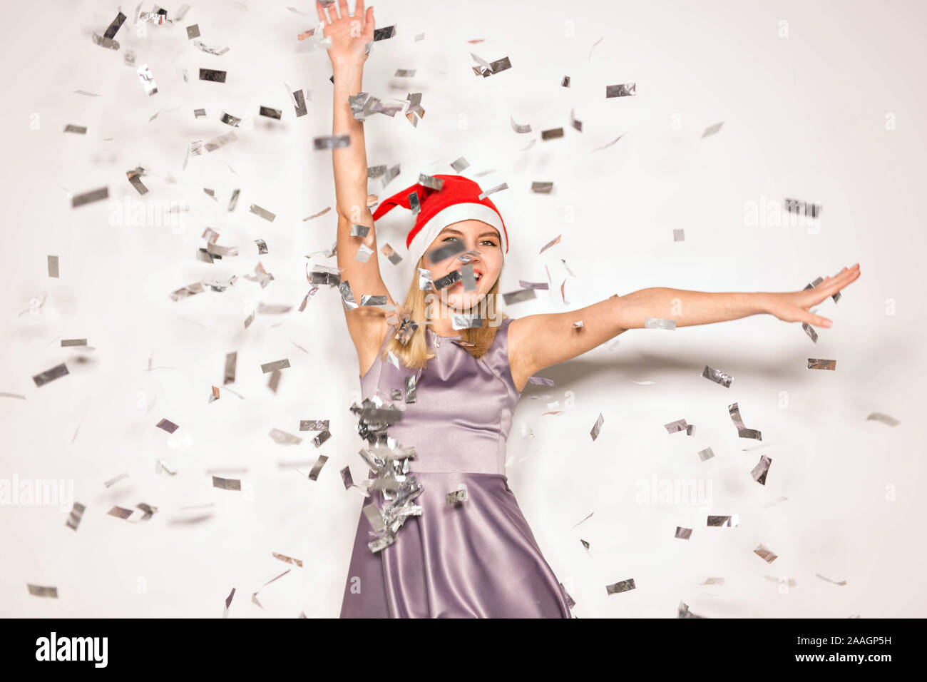 New year and holidays concept - Happy excited young woman in santa ...