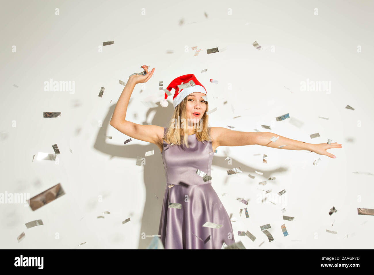 New year and holidays concept - Happy excited young woman in santa ...