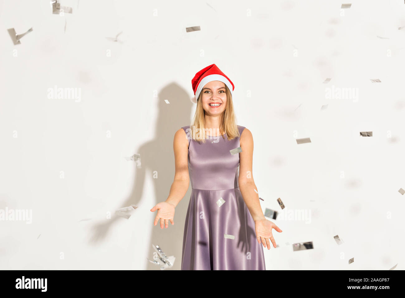 New year and holidays concept - Happy excited young woman in santa ...
