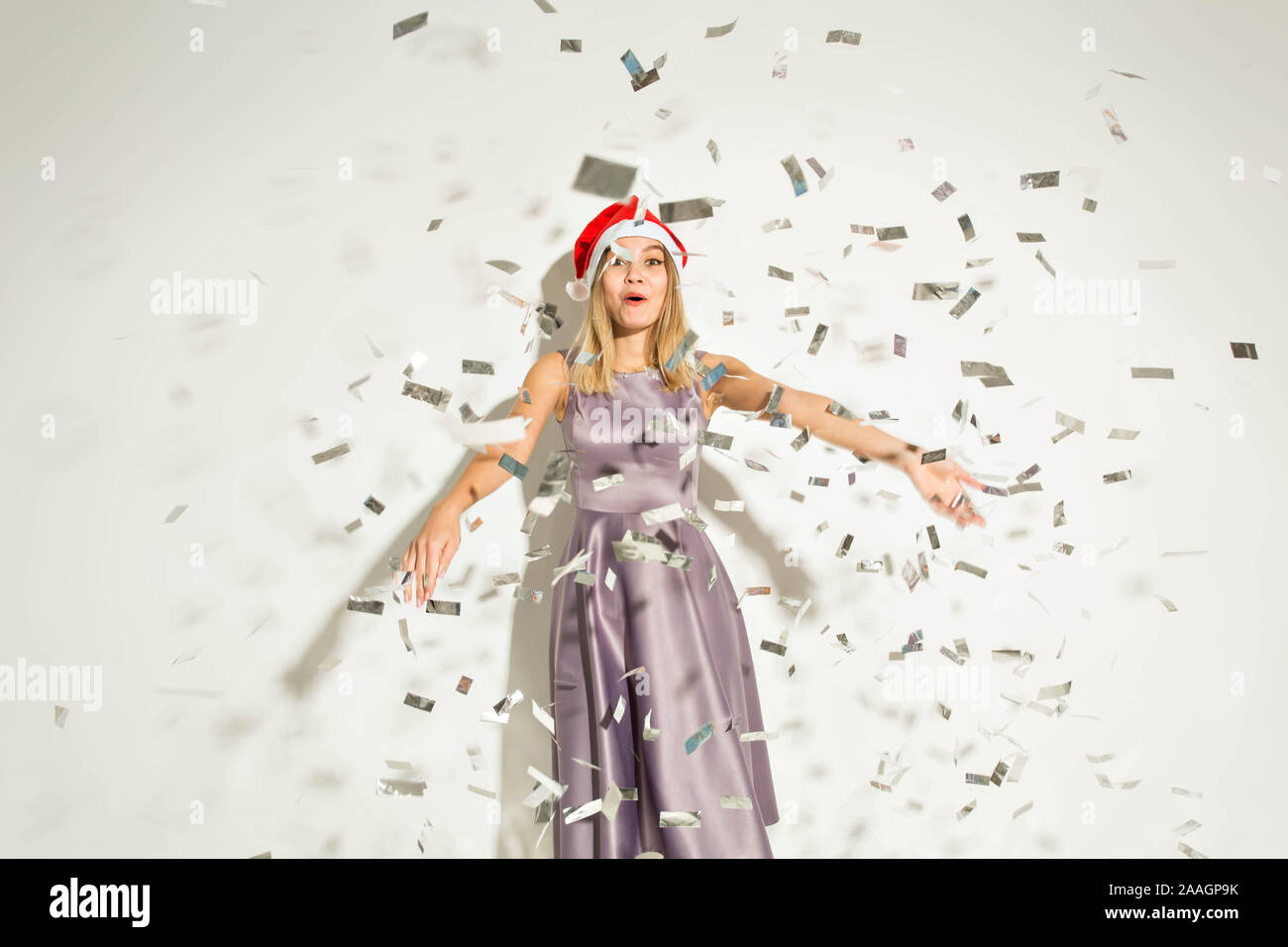 New year and holidays concept - Happy excited young woman in santa ...