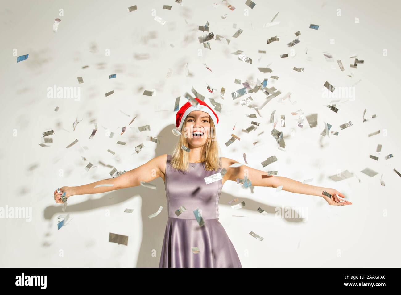 New year and holidays concept - Happy excited young woman in santa ...