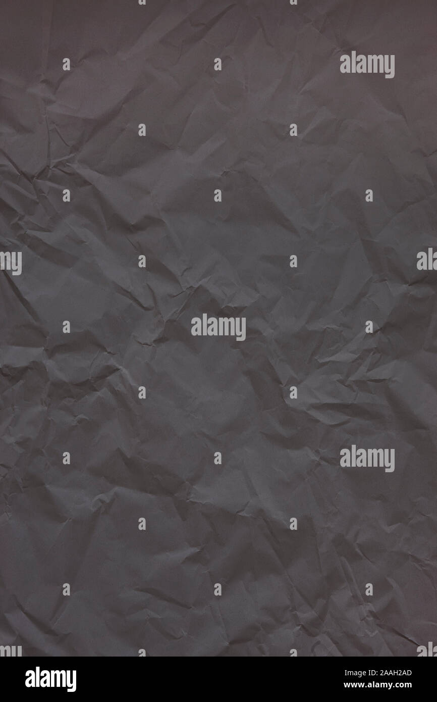 Black crumpled wrinkled textured paper background. Empty space Stock Photo