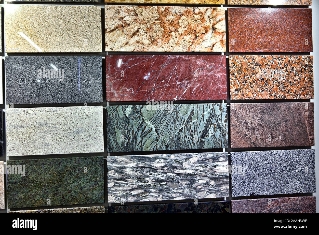 Colorful samples of a stone tile in store. Marble and granite ...