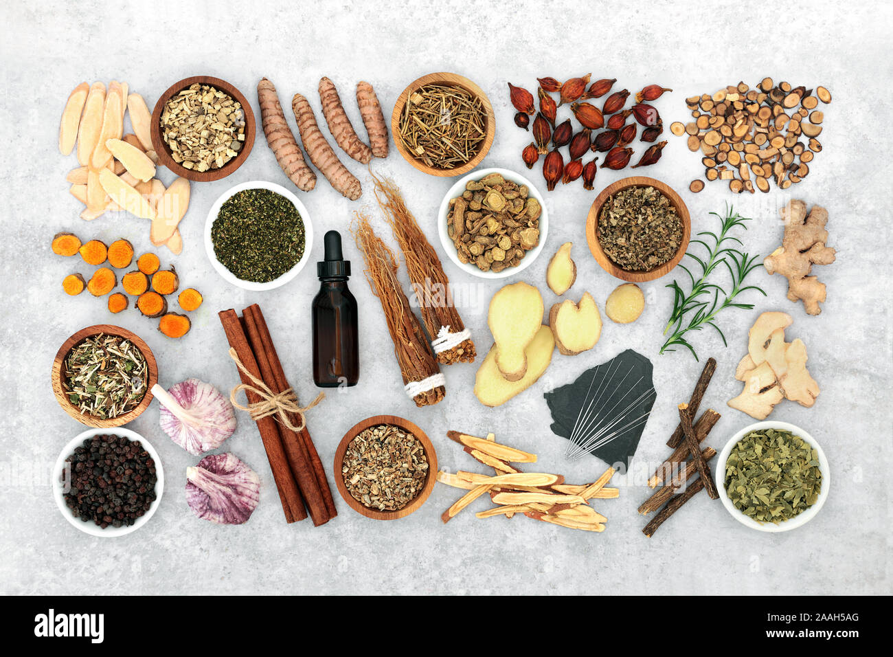 Herb and spice collection with acupuncture needles &  aromatherapy essential oil used in natural and chinese herbal medicine to treat asthma &COPD. Stock Photo