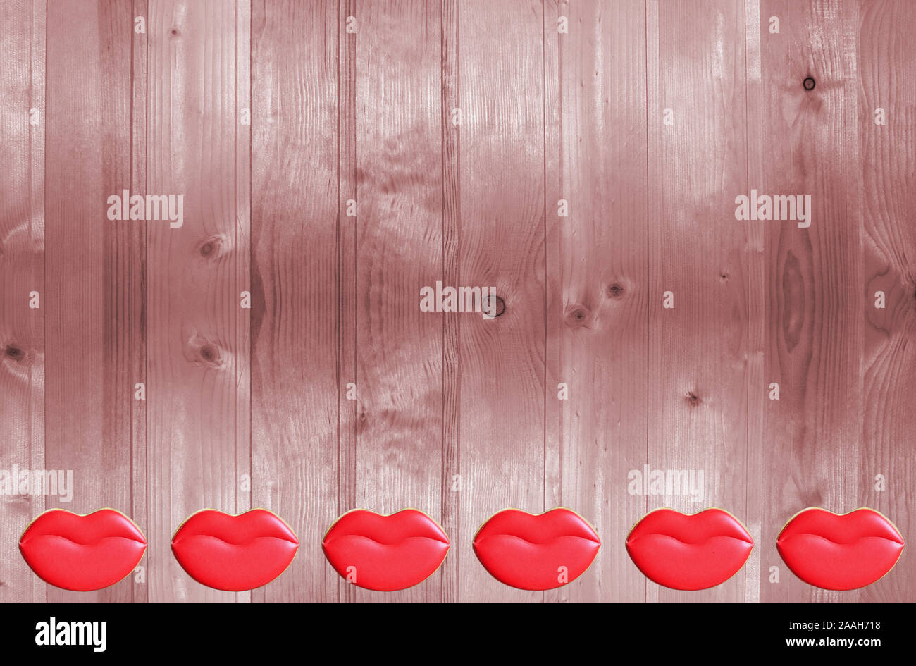 Valentine's day. Cookies in the shape of lips and heart on a wooden background. Stock Photo