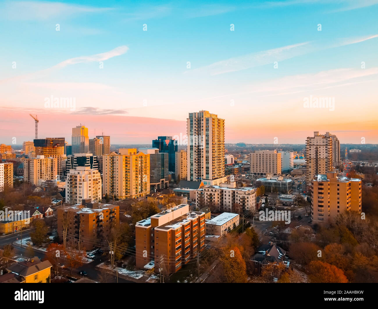 Aerial photo of the cityscape and downtown skyline in London, Ontario, Canada as the sun sets in late Autumn, November 2019. Stock Photo