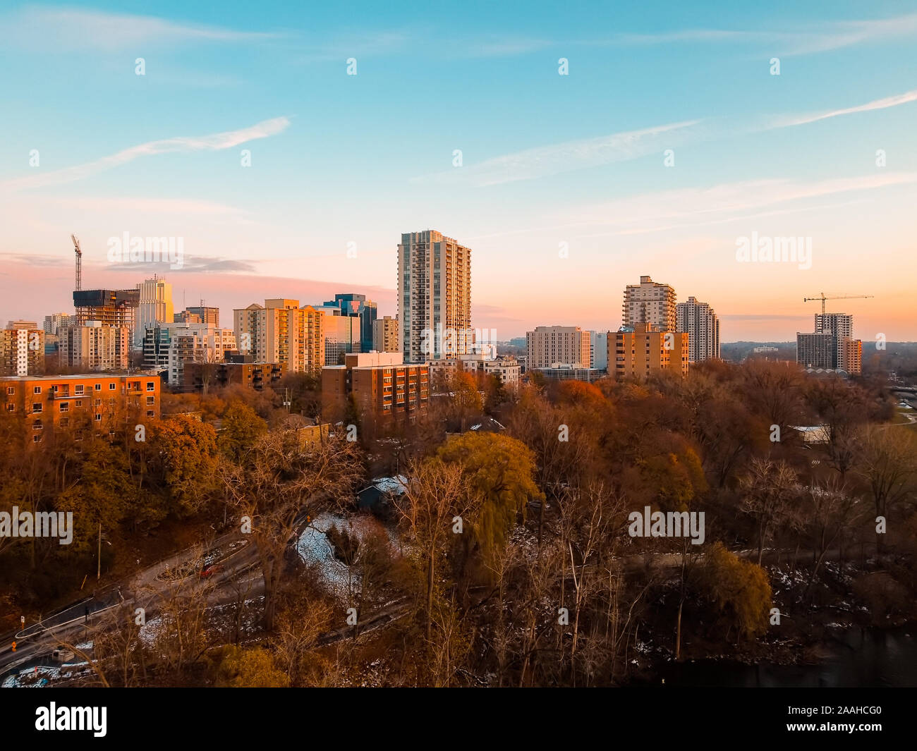 Aerial photo of the urban cityscape development and downtown skyline in London, Ontario, Canada at dusk in late Fall, November 2019. Shows the growing Stock Photo