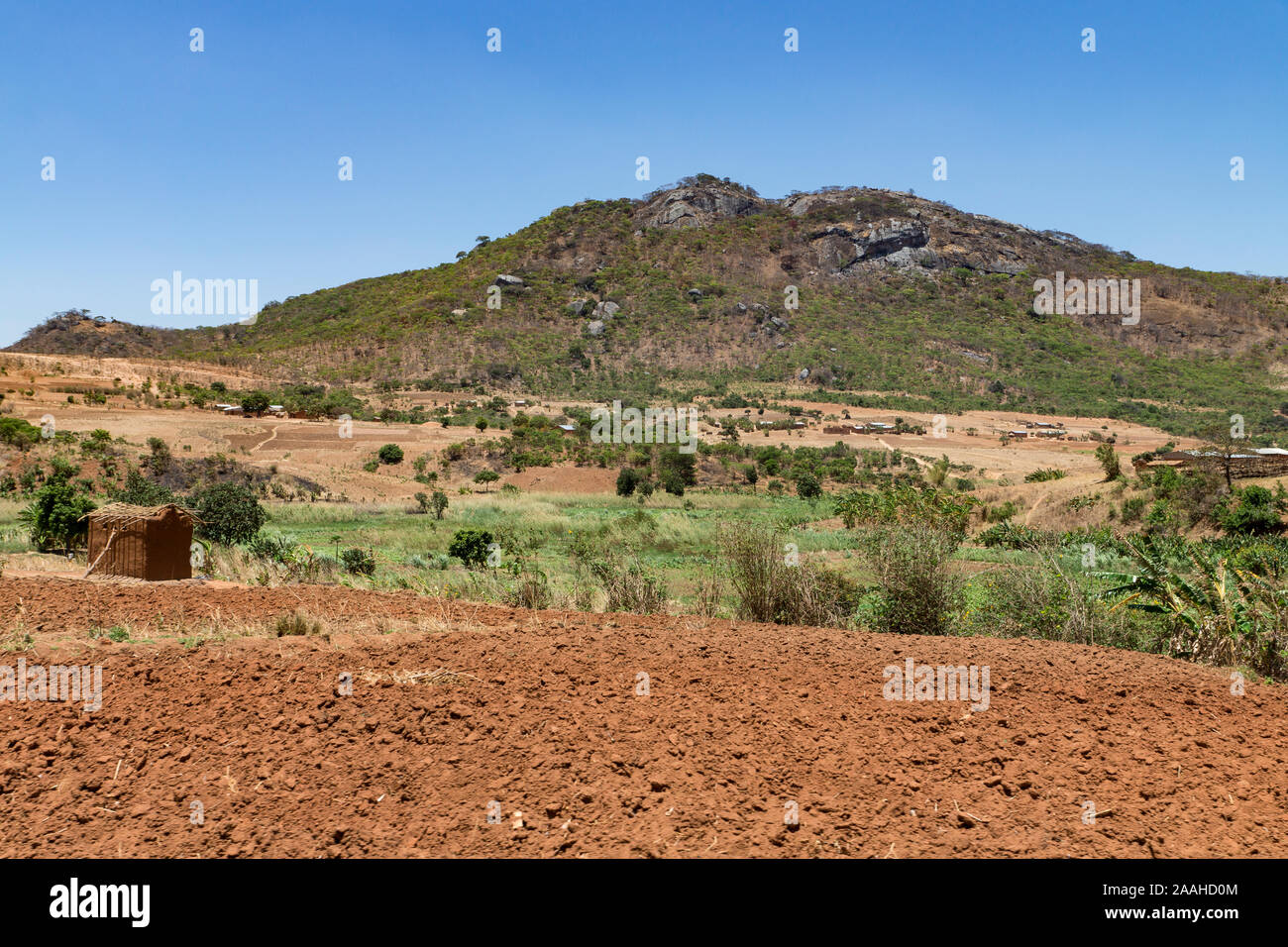 Agricultural landscape in northern Malawi - dry uplands contrast with green wetland / dambo Stock Photo