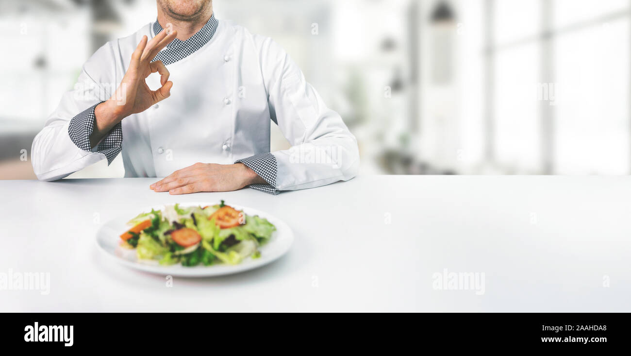 chef in restaurant showing ok sign with copy space Stock Photo