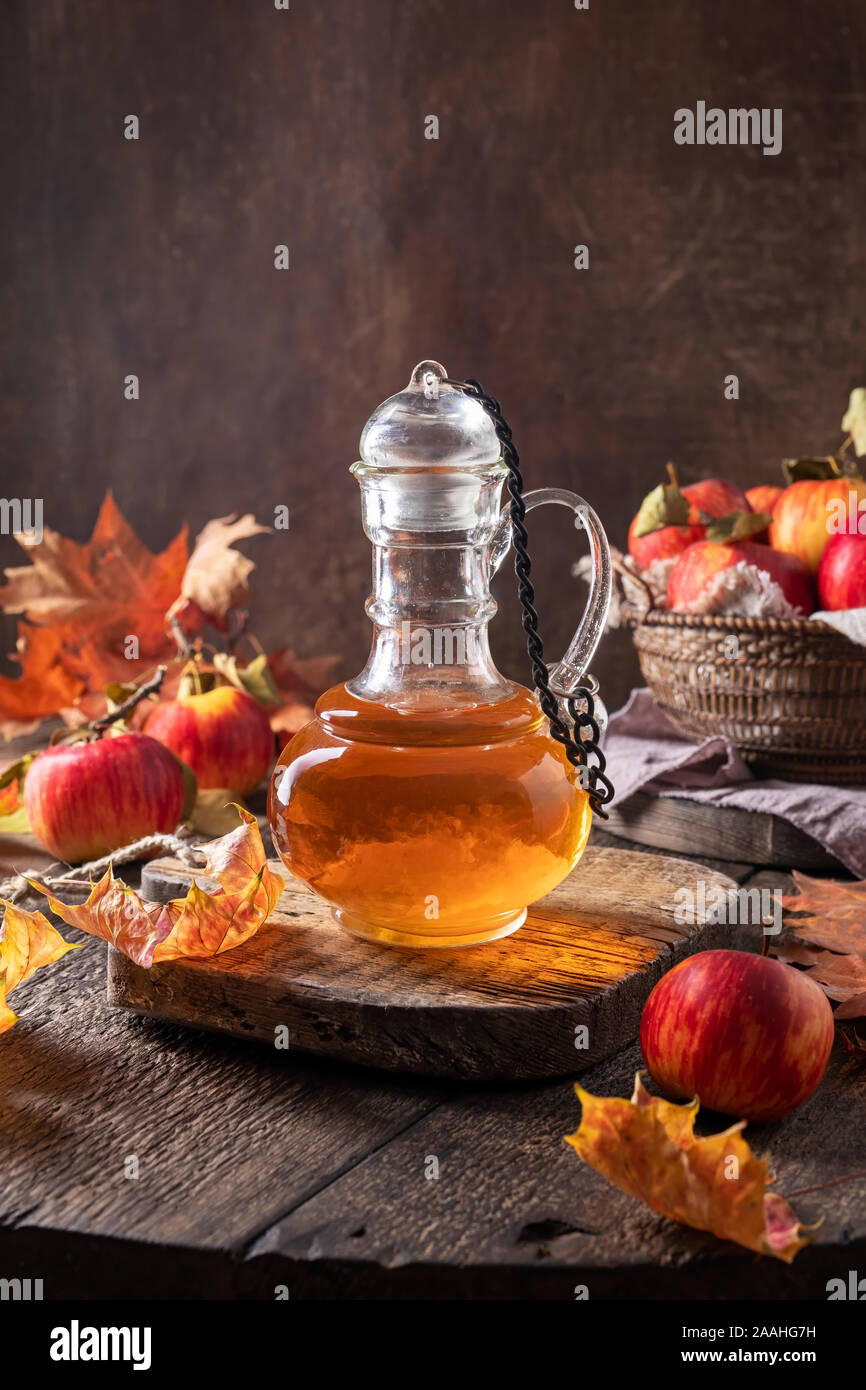 A bottle of apple cider vinegar on a table Stock Photo - Alamy