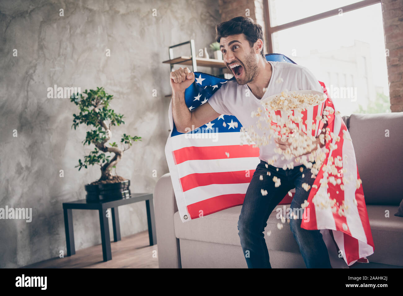 Bucket Arab Photo of multiethnic crazy arab guy sitting sofa hold popcorn bucket ...