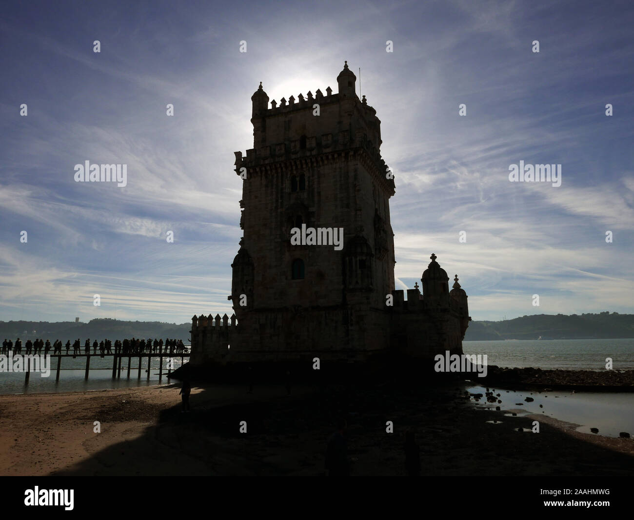 The Belem Tower on the River Tagus in Lisbon Portugal with the December sun behind putting it in shadow Stock Photo