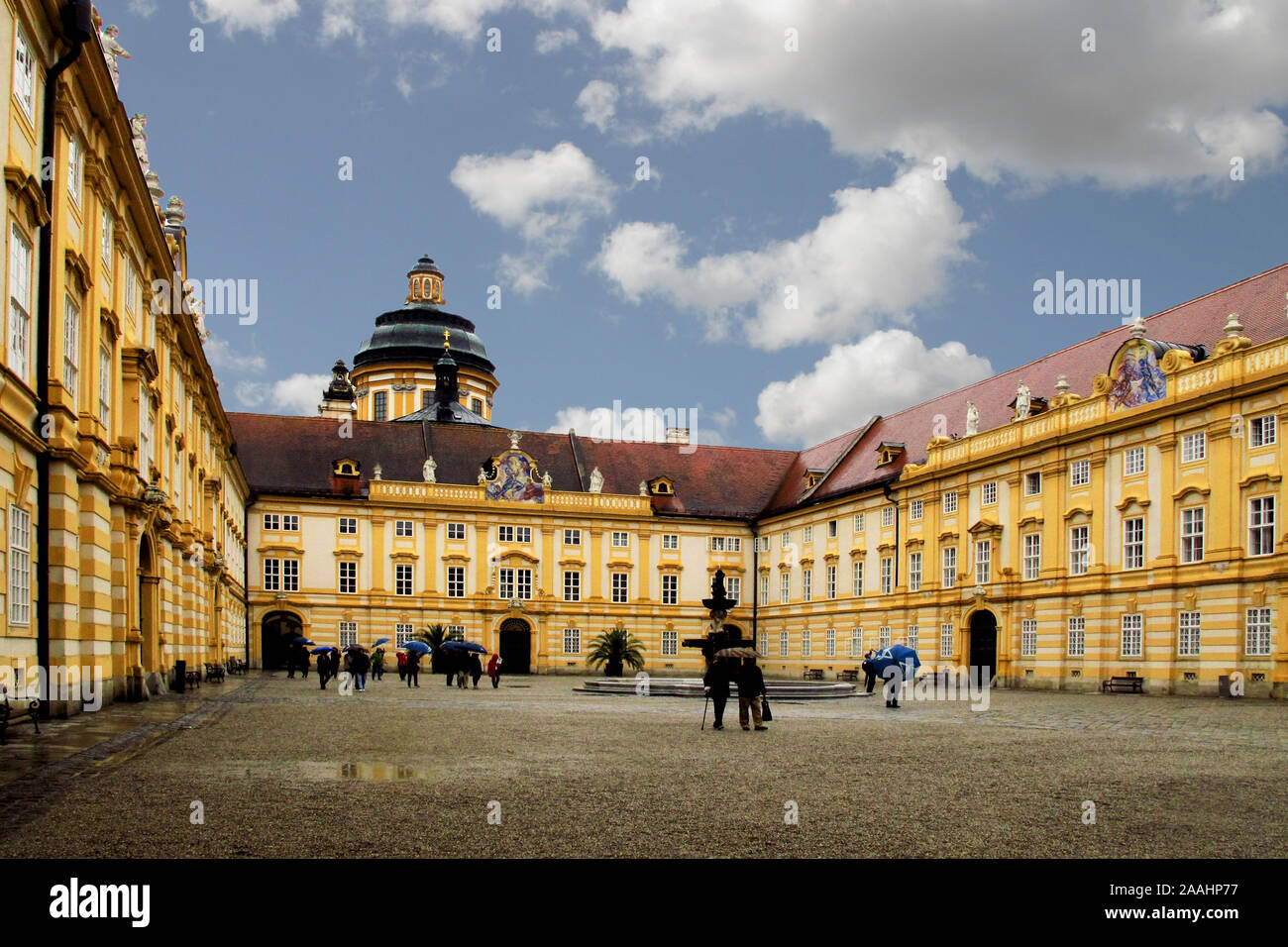 The dome and courtyard  of Melk Abbey, seen through an archway, a Benediction Monastery on the hill top above Melk in Austria Stock Photo