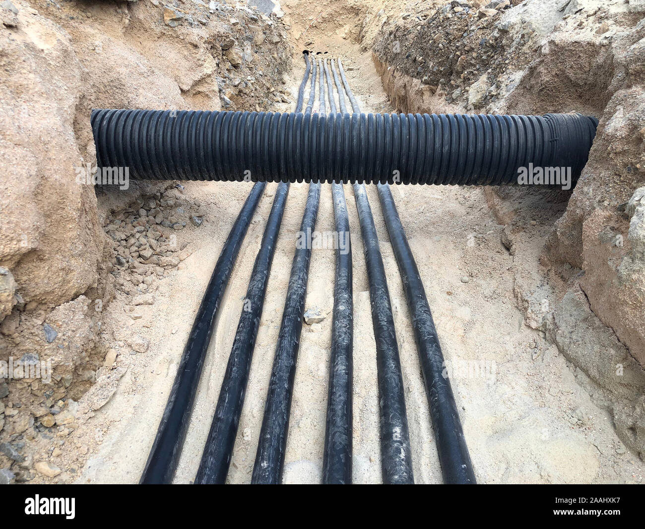 The high voltage electrical cable is laid in a trench under existing