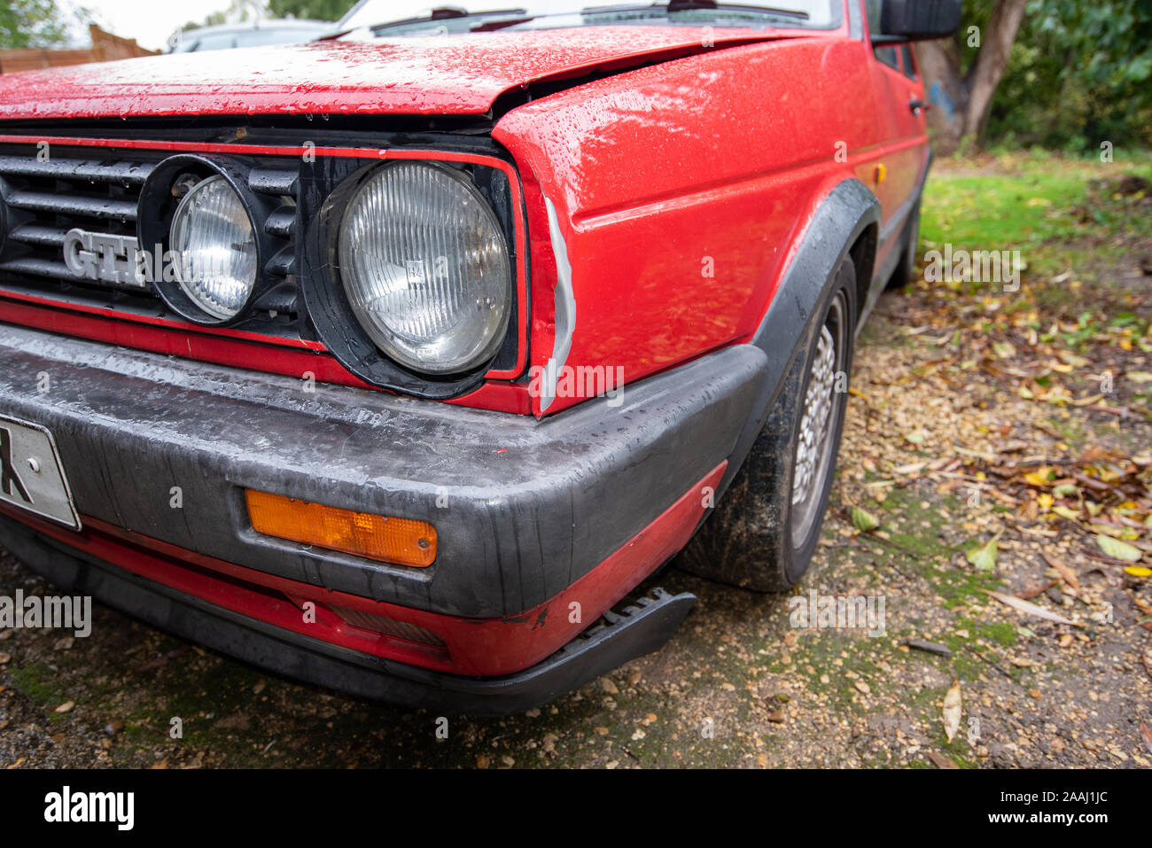 Classic Volkswagen Golf GTI red: Car crash damage and details close up.  Crushed metal and plastic. Front bumper damage after a road traffic  accident Stock Photo - Alamy