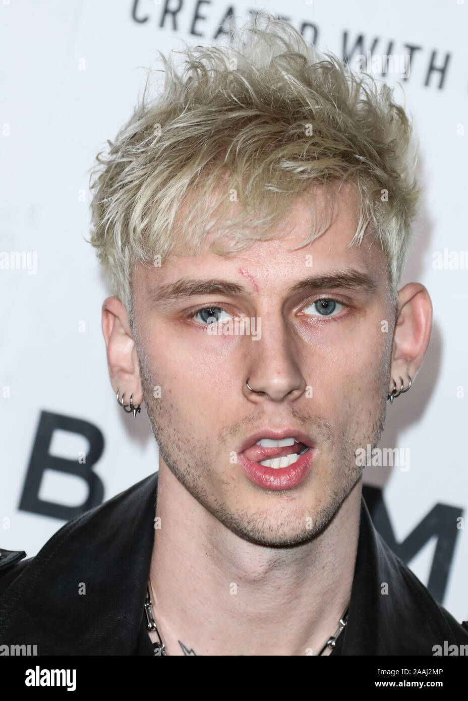 HOLLYWOOD, LOS ANGELES, CALIFORNIA, USA - NOVEMBER 21: Rapper Machine Gun  Kelly arrives at the PUMA x Balmain Los Angeles Launch Event held at Milk  Studios on November 21, 2019 in Hollywood,