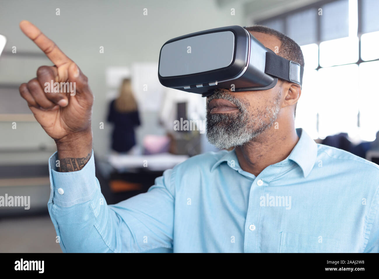 Business professional at work using VR Stock Photo