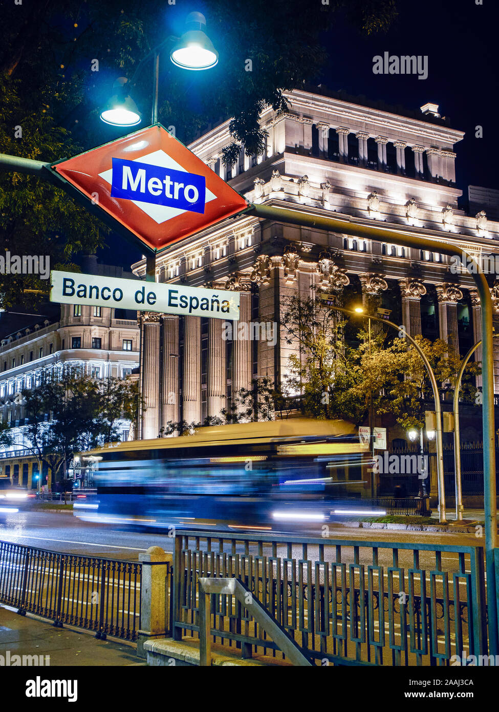 Banco de Espana Metro station signboard at nightfall with The Cervantes Institute building in the background. Madrid, Spain. Stock Photo