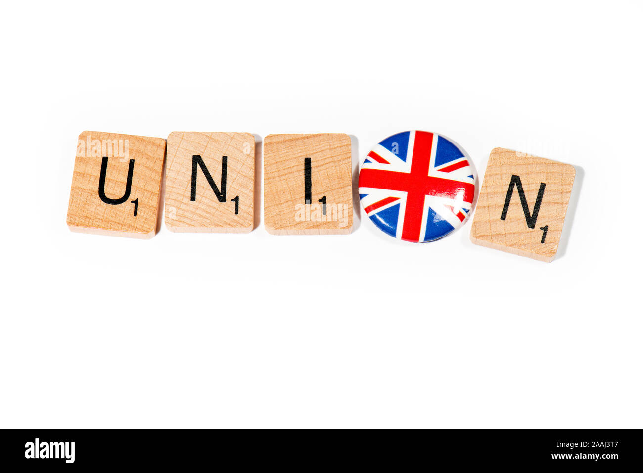 Conceptual: Scrabble letters spell out UNION with a Union Flag pin badge as the O. Stock Photo