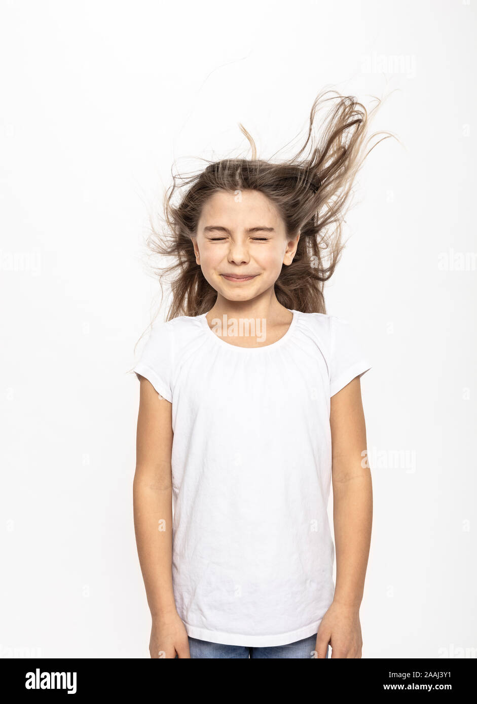 Girl with flying hair, white background Stock Photo