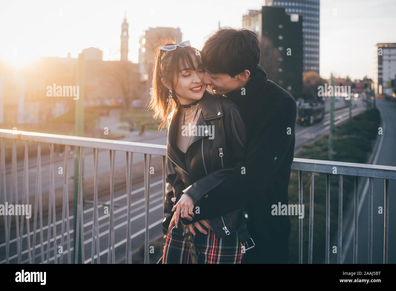 Trendy couple hugging hi-res stock photography and images - Alamy
