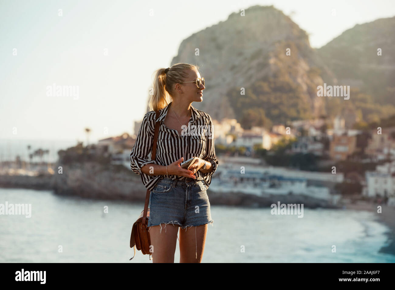 Woman traveller exploring island, Garraf, Spain Stock Photo
