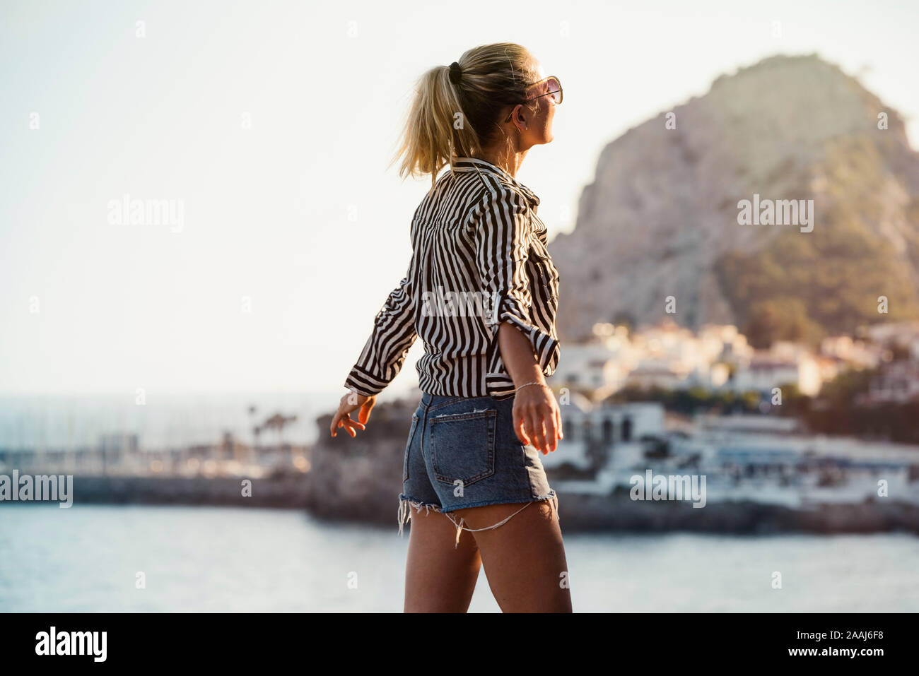 Woman traveller exploring island, Garraf, Spain Stock Photo