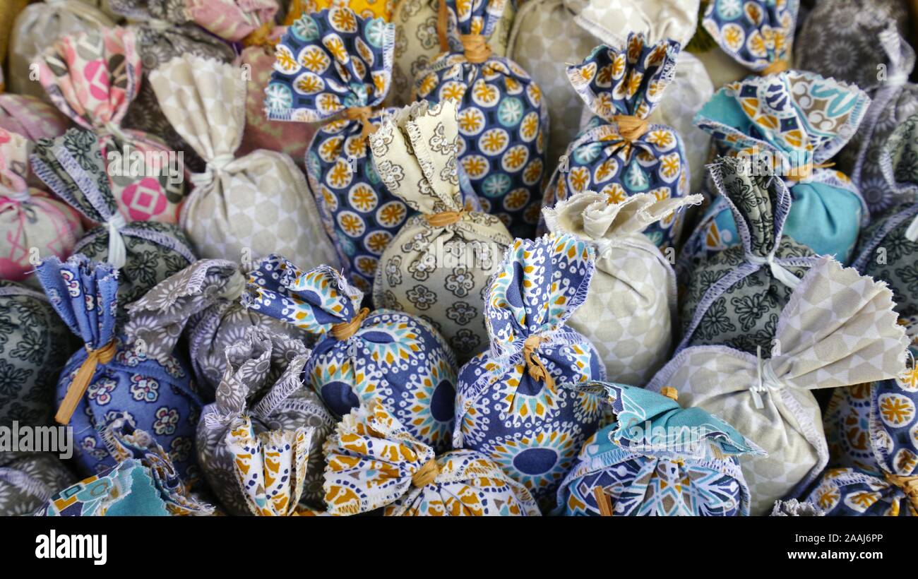 Fragrant dried lavender flowers in sachets in colorful Provencal fabric Stock Photo