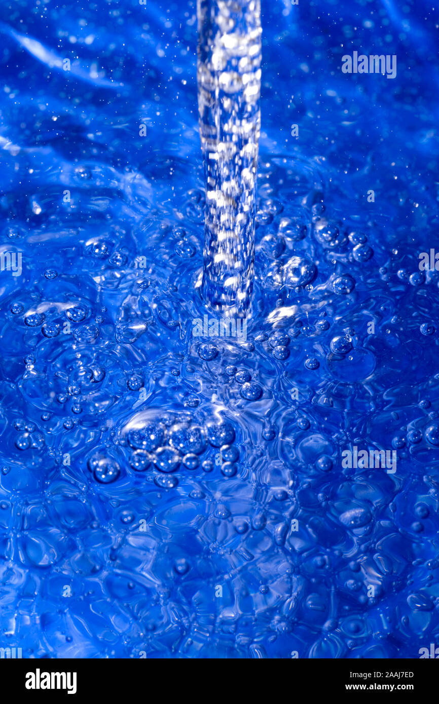 A jet of water generating bubbles Stock Photo Alamy