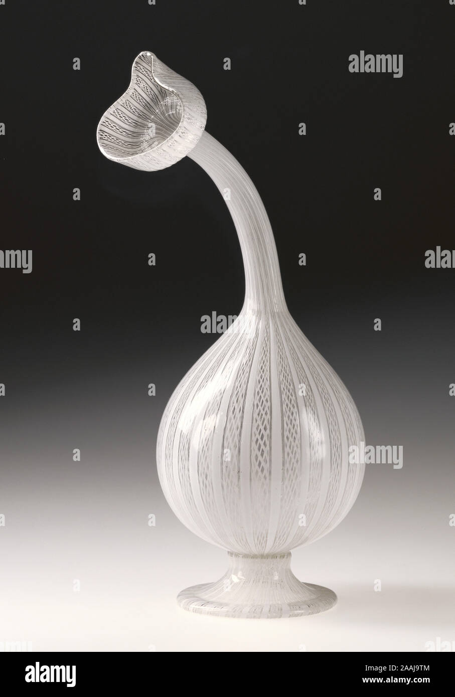 Filigrana Bottle (Kuttrolf); Unknown; Venice, Veneto, Italy; late 16th or early 17th century; Free- and mold-blown colorless (slightly gray) glass with lattimo canes; 23.8 cm (9 3/8 in.); 84.DK.661 Stock Photo