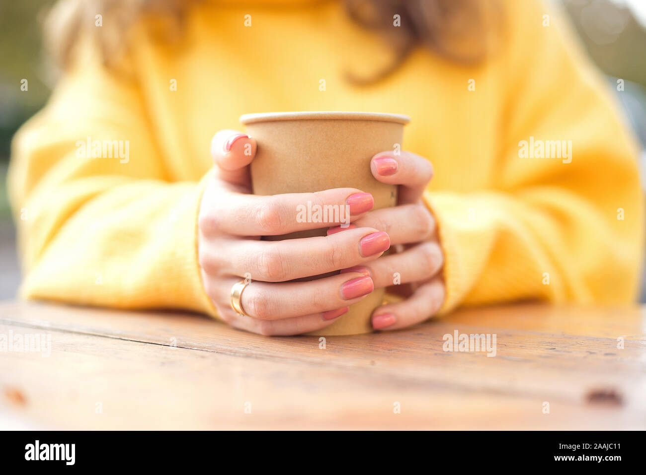 Hot girls coffee cups Girl S Hand Holding A Cup Of Kraft Paper Hot Coffee In A Cafe On The Street Stock Photo Alamy