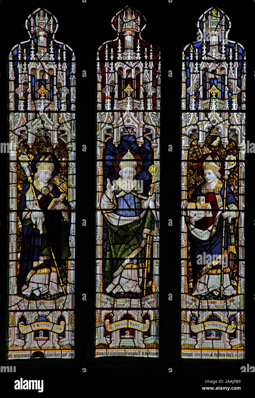A stained glass window by Burlison & Grylls depicting Saints Elbod, David and Cyndeyrn, Bangor Cathedral, Bangor, Gwynedd, Wales Stock Photo