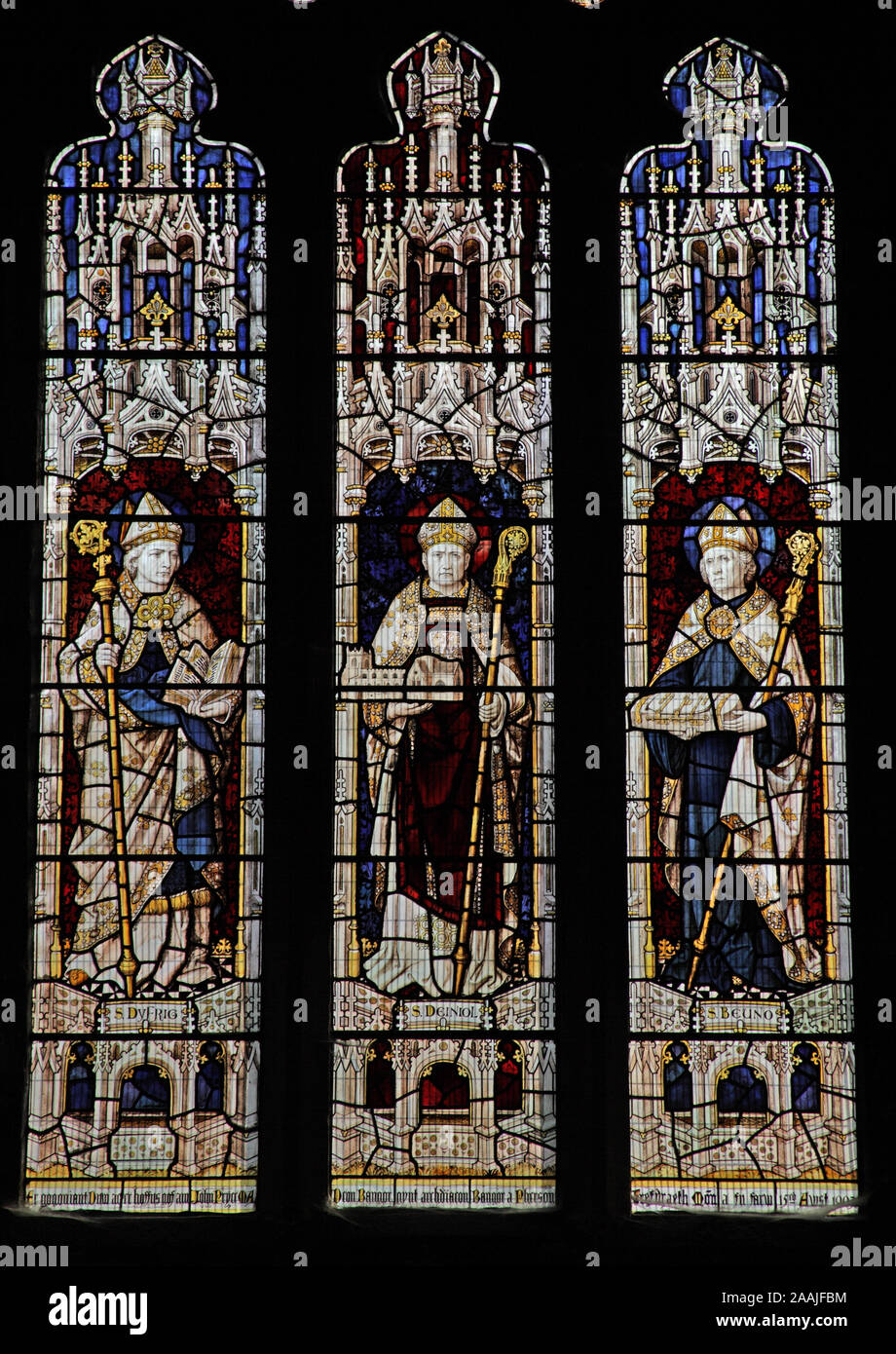 A stained glass window by Burliuson & Grylls depicting saints Dyfrig, Deiniol and Beuno, Bangor Cathedral, Bangor, Gwynedd, Wales Stock Photo