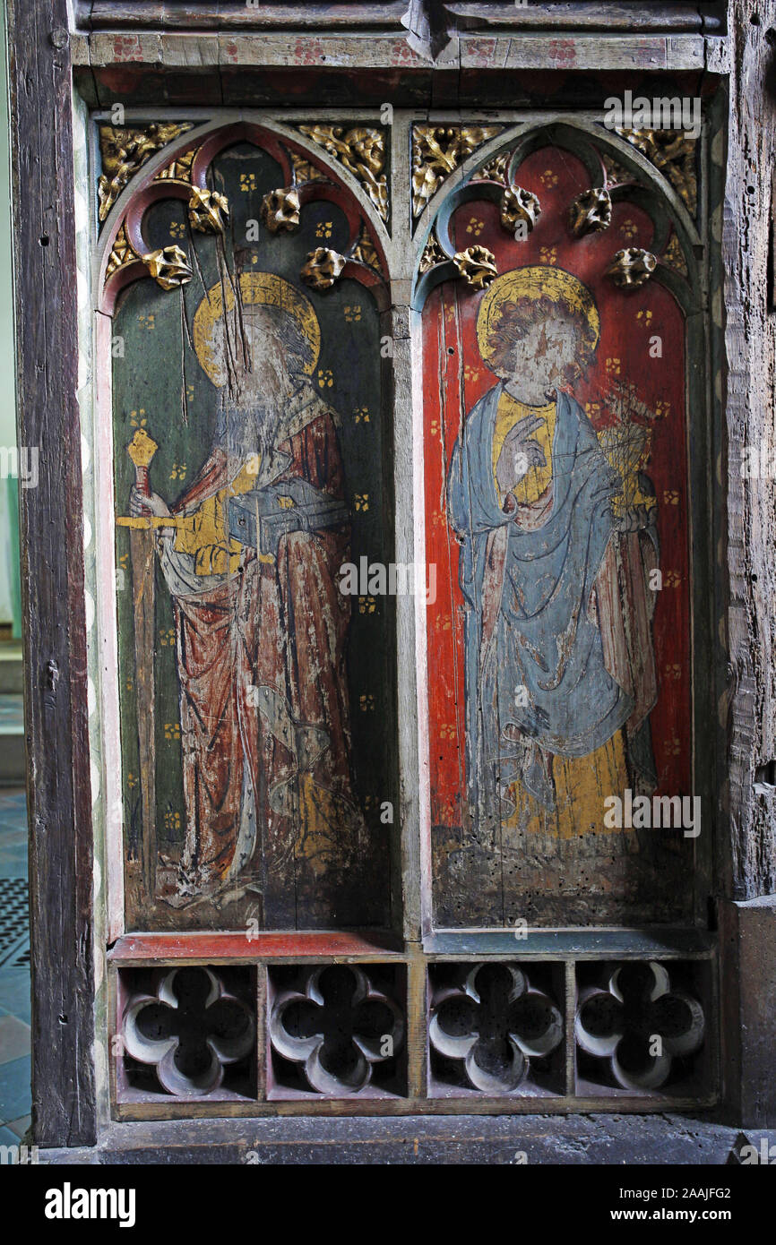 Painted rood screen depicting Ss Paul & John, heavily defaced and damaged during the iconoclasm of the Civil War, St Peter's Church, Belaugh, Norfolk Stock Photo