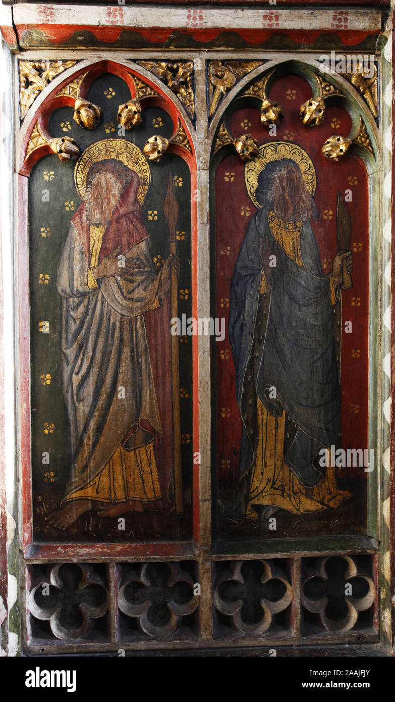 Painted rood screen depicting various saints, heavily defaced during the iconoclasm of the reformation, St Peter's Church, Belaugh, Norfolk Stock Photo